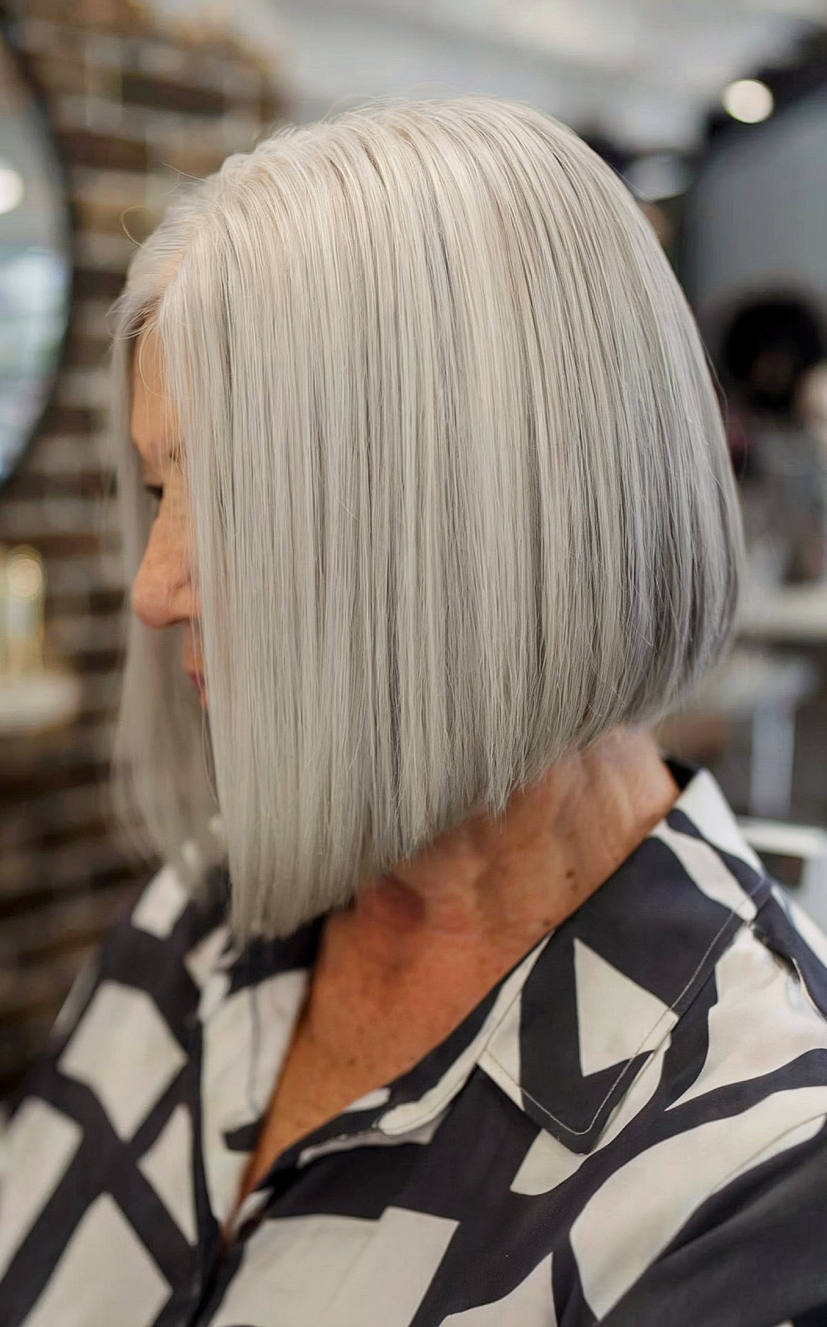 Angled Bob with Light Grey Balayage for older women with short straight hair