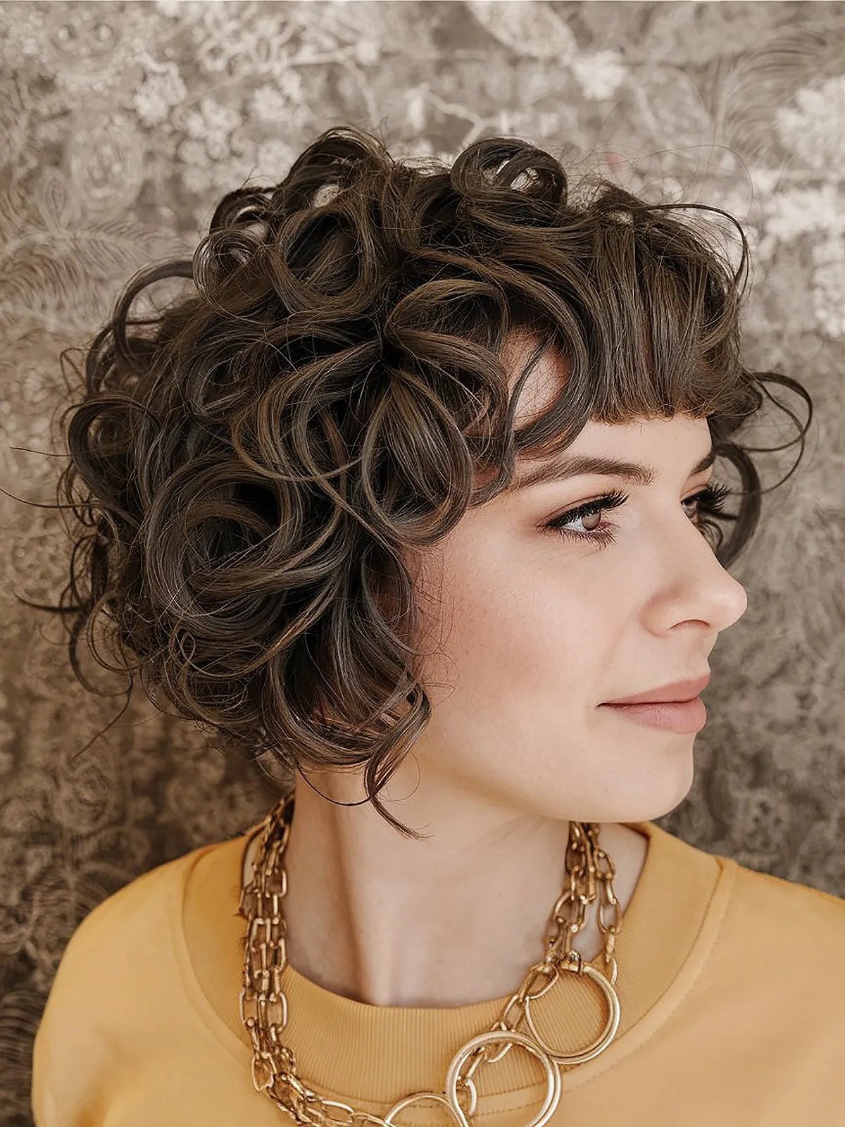 curly inverted bob with bangs
