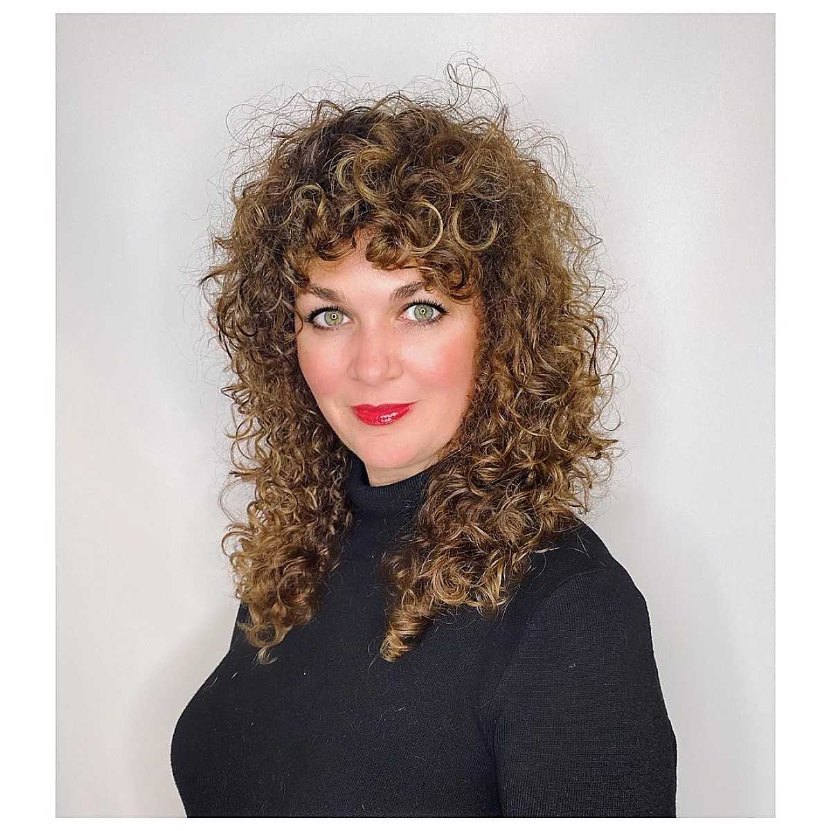 Disheveled curly shag haircut with bangs