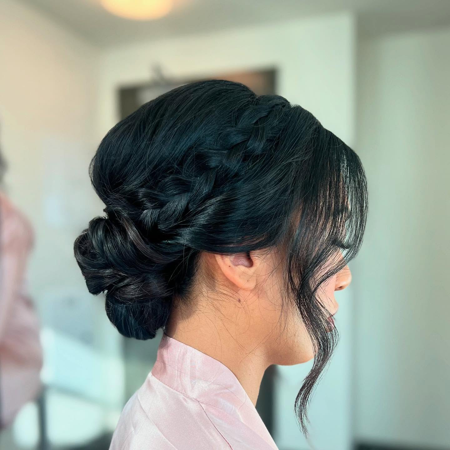 elegant braided updo with soft face framing waves