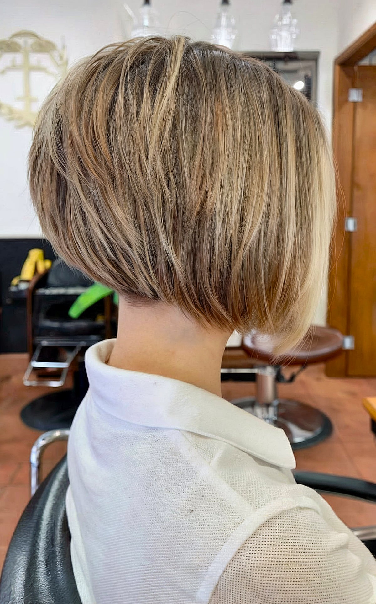 nicely stacked angled bob with blonde highlights