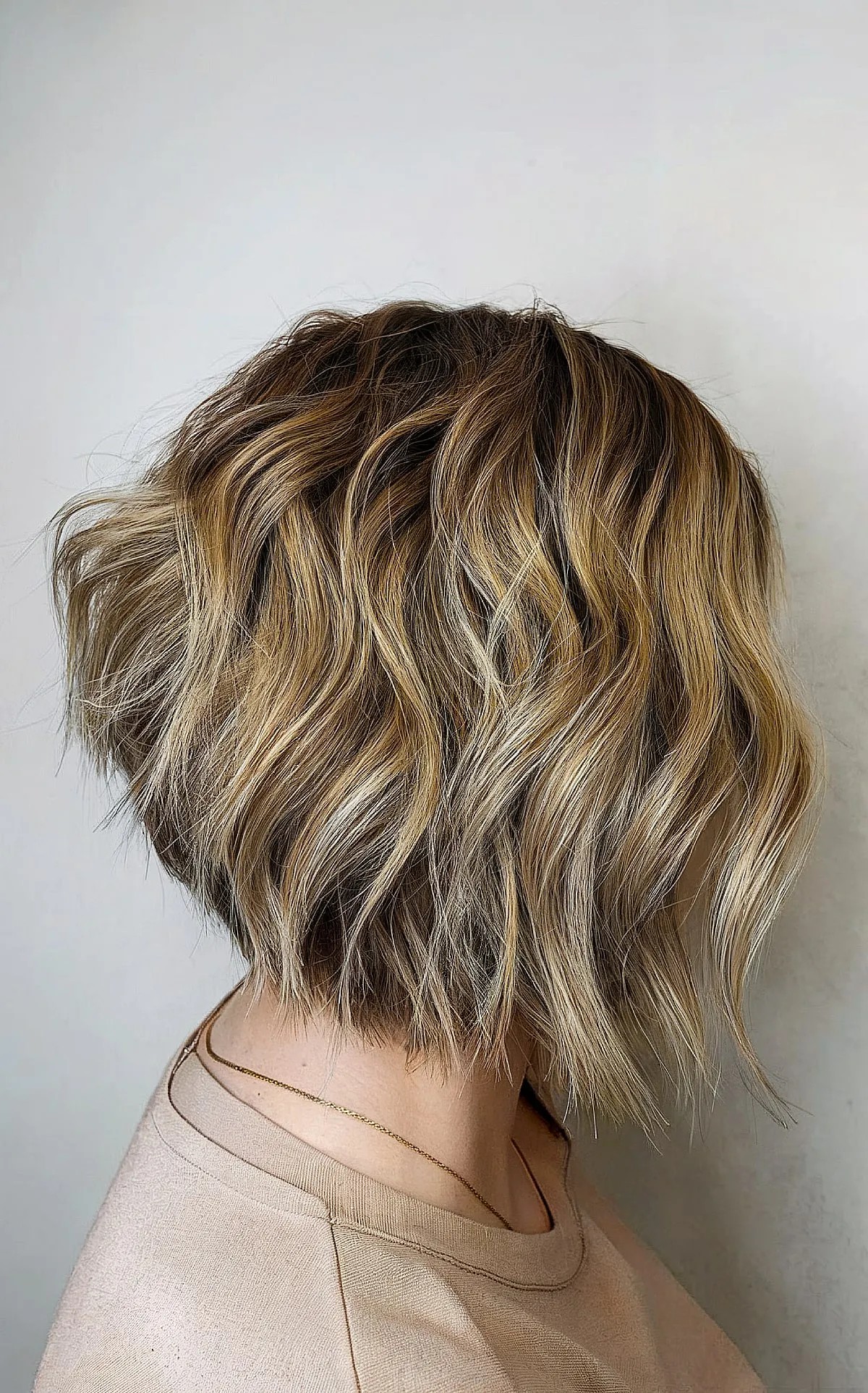 Chin-Grazing Stacked Choppy Bob with Blonde Balayage for Women