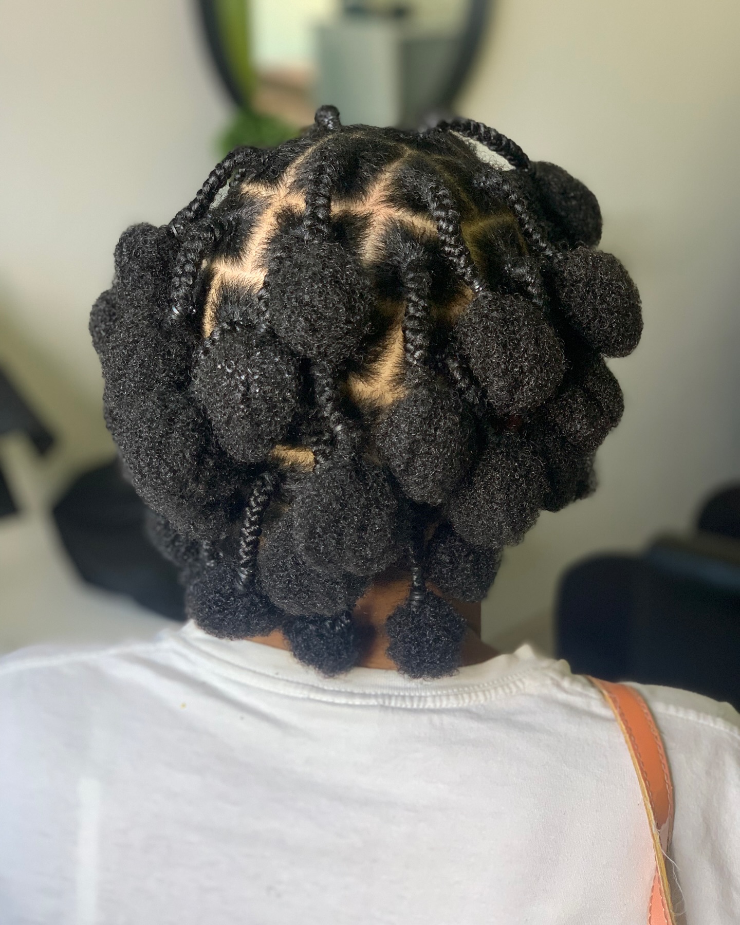 textured coily bantu knots with defined volume
